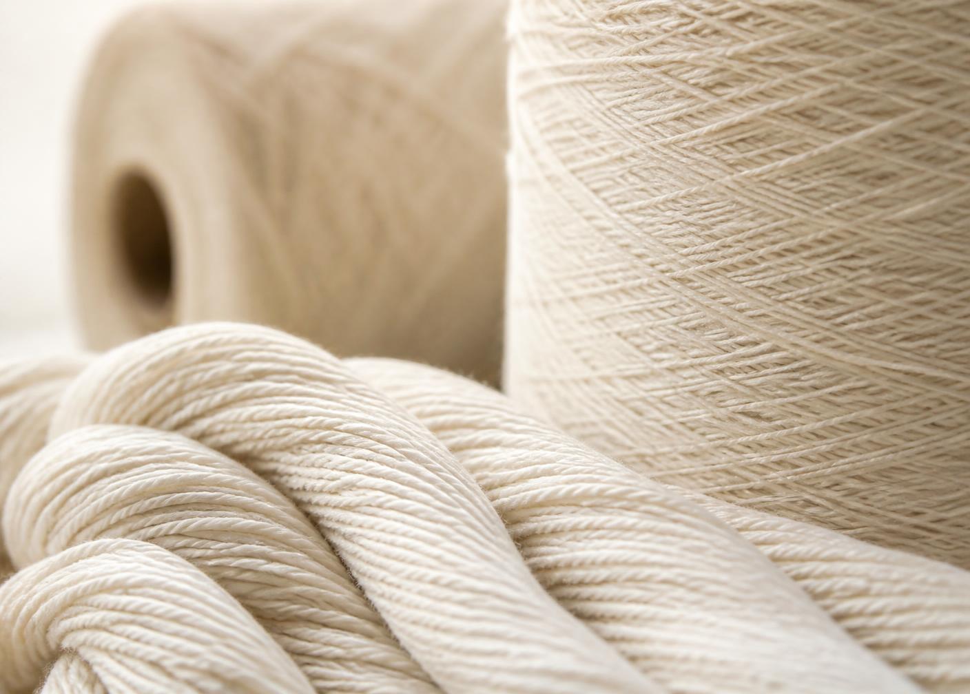 Macro view of cotton yarn cones and strands